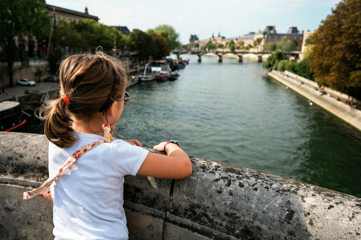 girl on the Seine River bridge